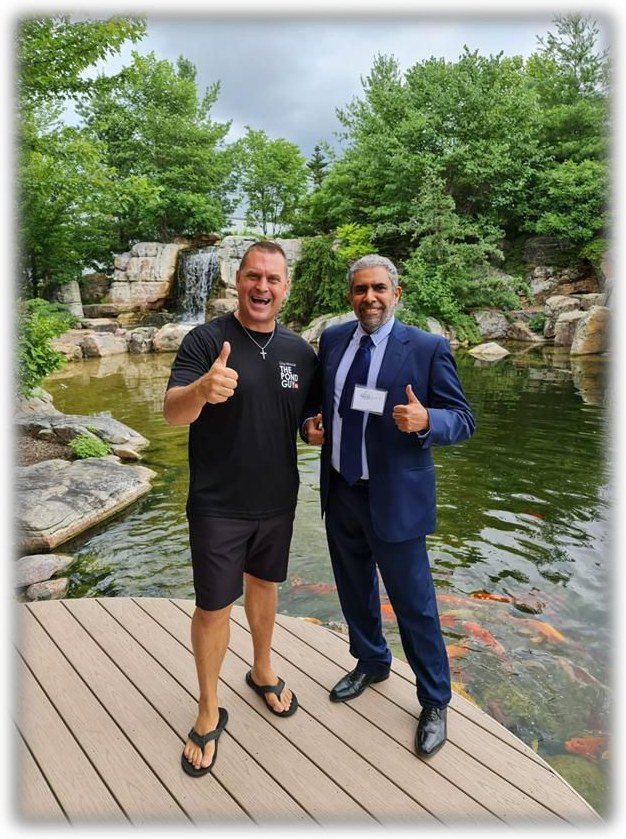 The founder of Aqua Horizons standing with Greg Wittstock, founder of Aquascape Inc.