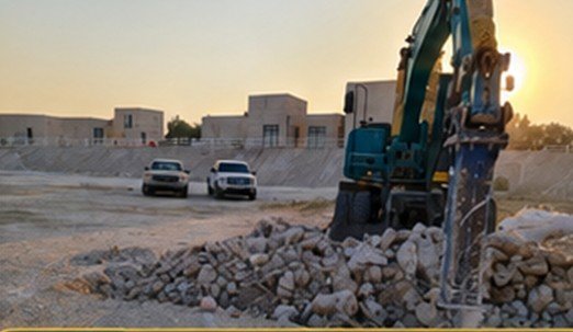Excavating the pond basin and stream course