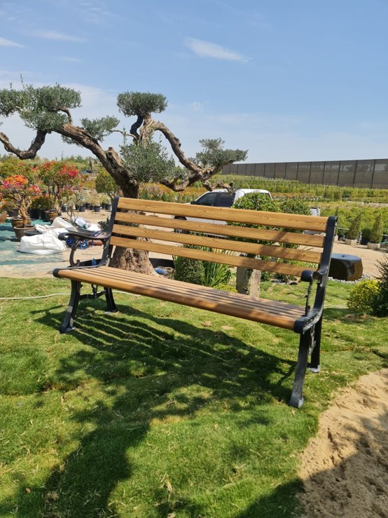 Stone and timber garden bench in a planted setting